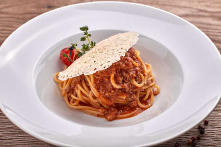 Spaghetti Bolognese on a white plateの写真素材