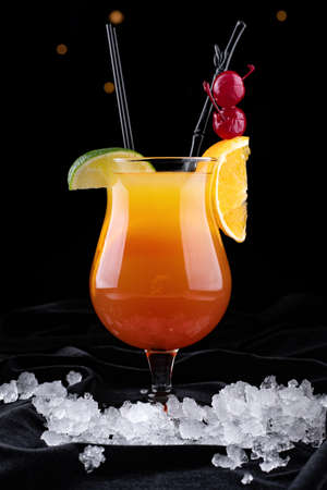 Tequila Sunrise cocktail, on a black backgroundの写真素材