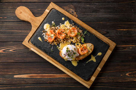 Bruschetta with salmon and poached eggsの写真素材