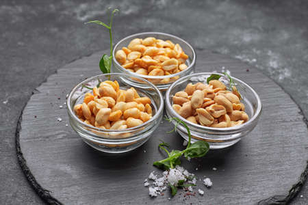 Roasted peanuts for beer, on a dark background