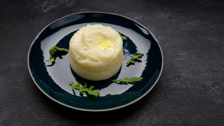 Mashed potatoes on a plate, on a dark backgroundの写真素材