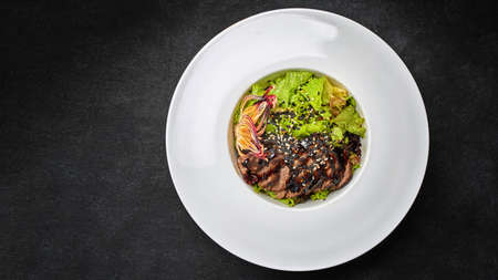 Warm salad with chopped veal, on a plateの写真素材