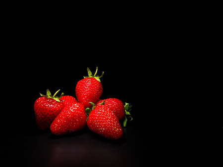 Strawberries on a black background. Isolateの写真素材