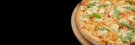 Four cheese pizza quattro fromaggi with arugula leaves on a black backgroundの写真素材