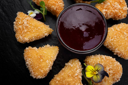 Fried cheese nuggets with berry sauce sauceの写真素材