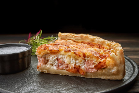 on a black stone, on a wooden backgroundの写真素材