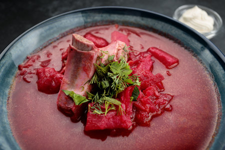 savory Ukrainian borscht with pork ribs, greens and sour creamの写真素材
