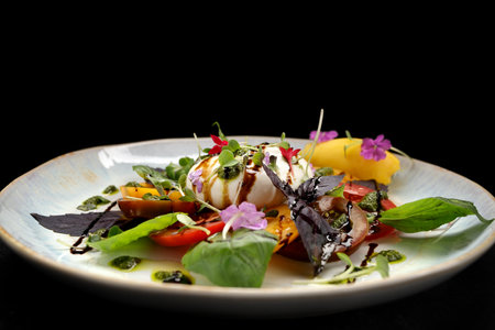 Mouthwatering burrata cheese accompanied by vibrant vegetables and fragrant herbs