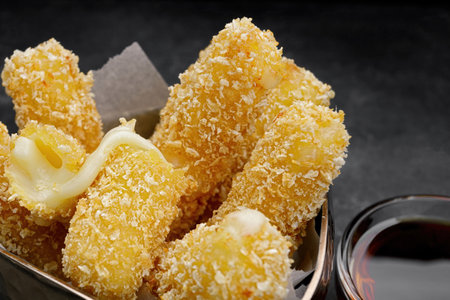 Fried nuggets with cheese and jam, on a dark backgroundの写真素材