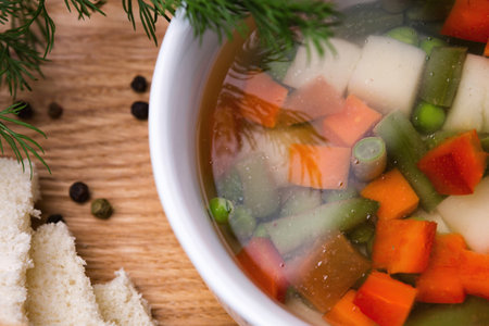 Vegetable soup with potato, peas, onions and carrots, Close-upの写真素材