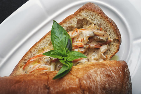 Ciabatta with seafood on a white plate close-upの写真素材