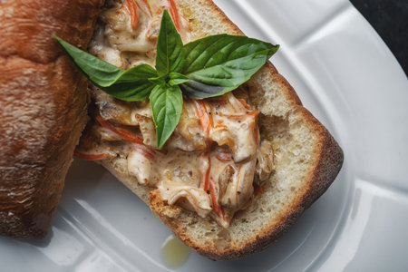 Ciabatta with seafood on a white plate close-upの写真素材