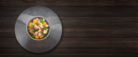 Fresh shrimp ceviche served in a bowl on a dark textured surface. Bright colors and citrus garnish.の写真素材