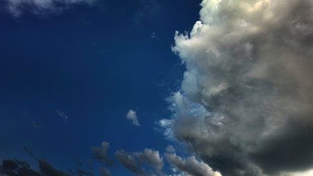 Dramatic blue sky with approaching storm clouds. Ideal for wallpapers and backgrounds. Highlights...