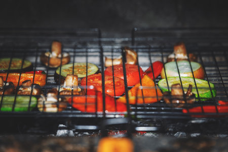 Colorful grilled vegetables on metal grate, healthy food concept for culinary photography.の写真素材