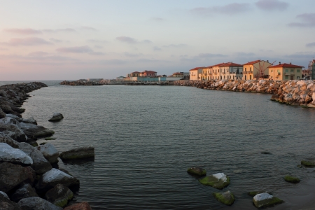Marina di Pisa sunset view of the town's waterfront street.の写真素材