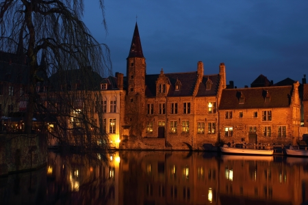 Late evening shot of Rozenhoedkaai in the old city Bruges in Belgium.の写真素材