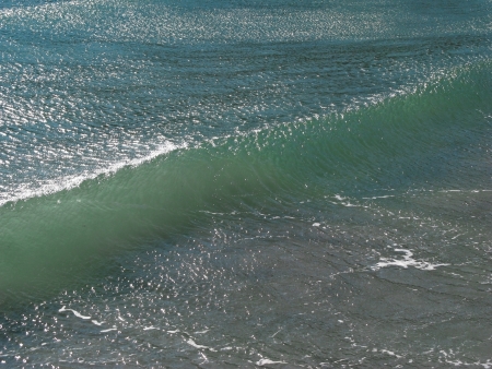 Crystal Clear Wave captured in bright sunny day moving toward the shore.の写真素材