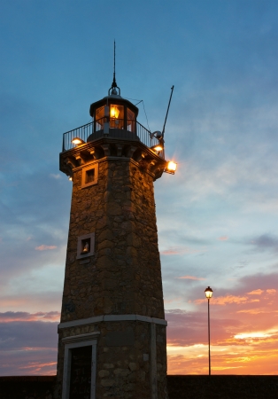 Desenzano Del Garda the old Lighthouse close up shot in an early morning beautiful sunrise.の写真素材