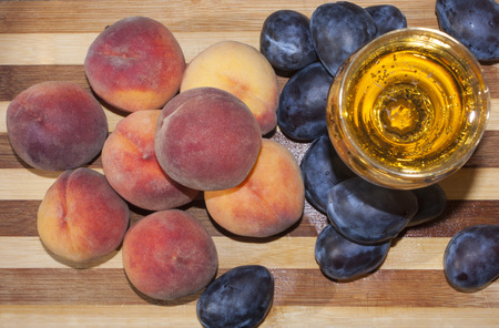 Peaches and plums with wine.の写真素材
