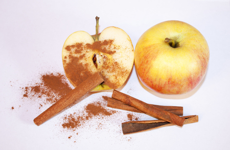 Yellow apple with cinnamon.の写真素材