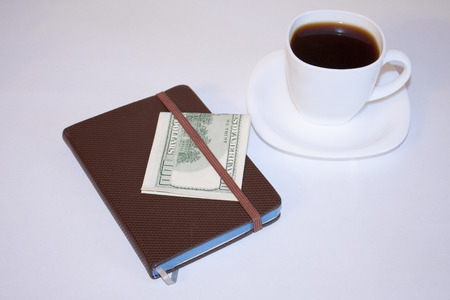 Morning coffee and drawing up plans for the day.の写真素材