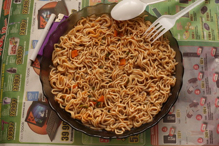 Instant noodles soup eaten by workers for lunchの写真素材