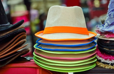 Pile of colorful hats are on sale at the marketplaceの写真素材