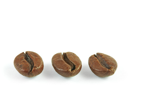 Coffee beans close up isolated over white backgroundの写真素材