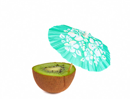 Kiwi with drink cocktail umbrella isolated on whiteの写真素材