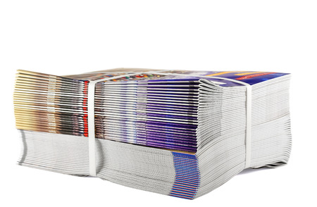 Pile of bundled magazines isolated on white backgroundの写真素材