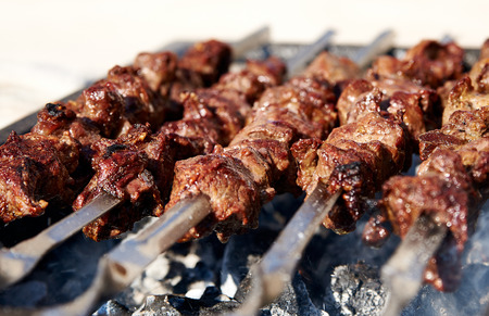 Barbecue skewers with meat on brazier