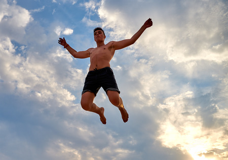 Lazurne, Ukraine - August 23, 2015: Flying man over beautiful sky at the youth festival Crazy Days...
