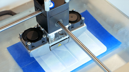 Automatic three dimensional 3d printer performs product creation. Modern 3D printing or additive...