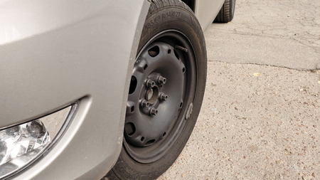 Wheel tire and headlight. Automobile components concept. Detailed shot.