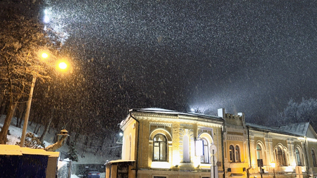 Snow blizzard in the night city. Christmas romantic mood weatherの写真素材