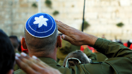 Jerusalem, Israel - May 25, 2017: Israeli soldier military man saluting to the Western wall in Jerusalem. Western wall or Wailing wall or Kotel is the most sacred place for all jewish people.のeditorial素材