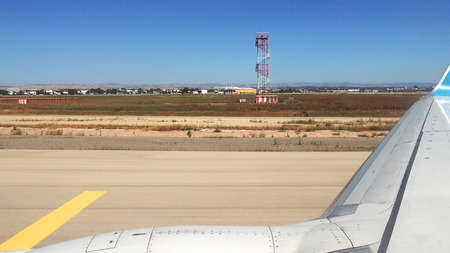 Plane is driving on the runway in the airport landing field. Passenger airplane is getting ready to take off to flight.の写真素材