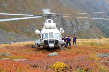 Rescue team near by helicopter. Altai Republic, Russiaのeditorial素材