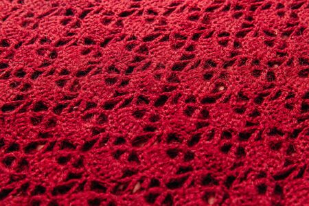 Pink wool knitted fabric with texture. Handwork.