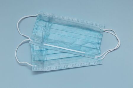 Surgical mask with rubber straps. A three-layer surgical mask for covering the mouth and nose....