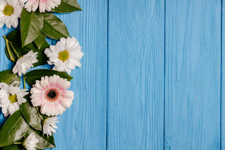 Beautiful flower arrangement. Spring minimalistic concept. White flowers on a wooden table....