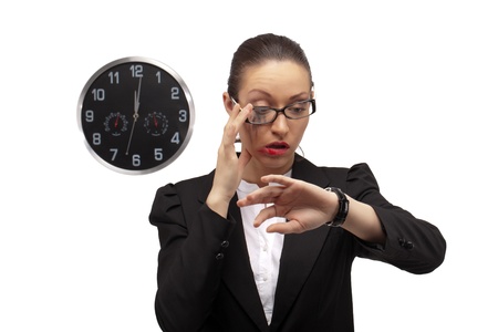 Business lady watching on clock... Oops, it's already 12 o'clock, time to loose all her beauty starting from make upの写真素材