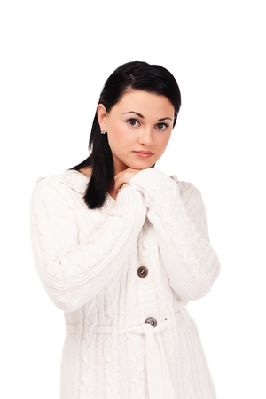 Young woman in white knitted dressing gown on isolated white backgroundの写真素材