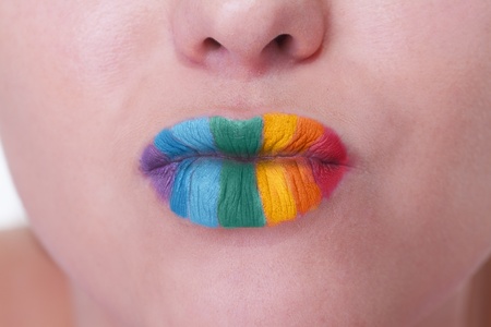 Girl with rainbow pattern on lips is ready for kissの写真素材