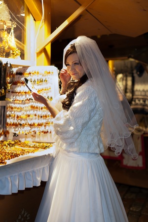 Bride on the winter fair is looking for the presentの写真素材