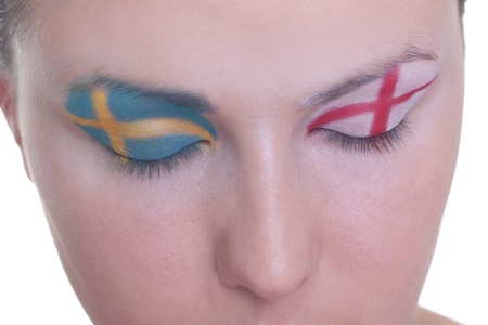 Young girl is dreaming about score in match between Sweden and Ukraine: EURO 2012, group D, 15th of June. Focus on eyelashes.の写真素材