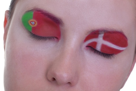 Young girl is dreaming about score in match between Portugal and Denmark: EURO 2012, group B, 13th of June. Focus on eyelashes.の写真素材
