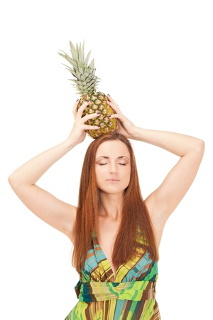 Girl with pineapple is pretending it is a crownの写真素材
