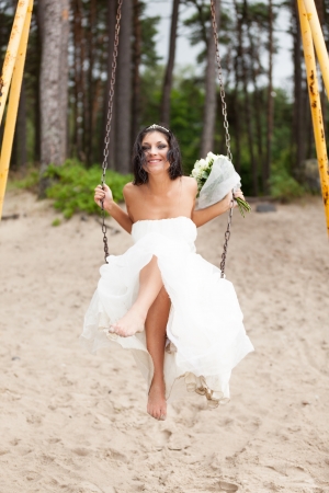 Runaway bride on a swingの写真素材